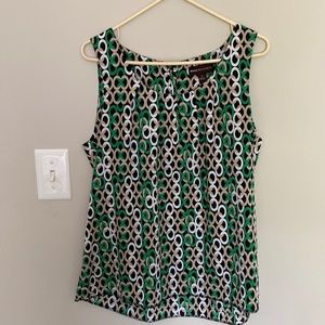 Green, tan, black and white sleeveless blouse